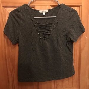 Cropped T-shirt with laces at the neck